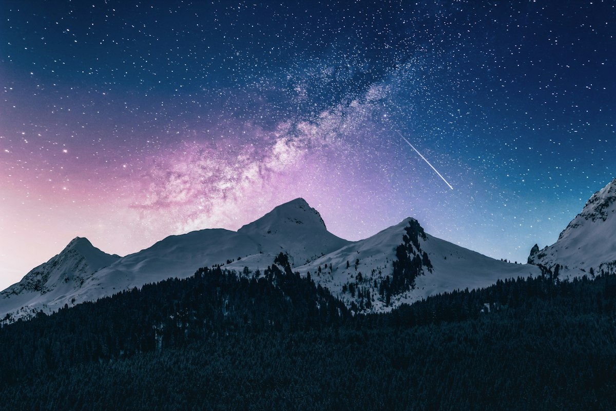 Starry night sky over archery camp
